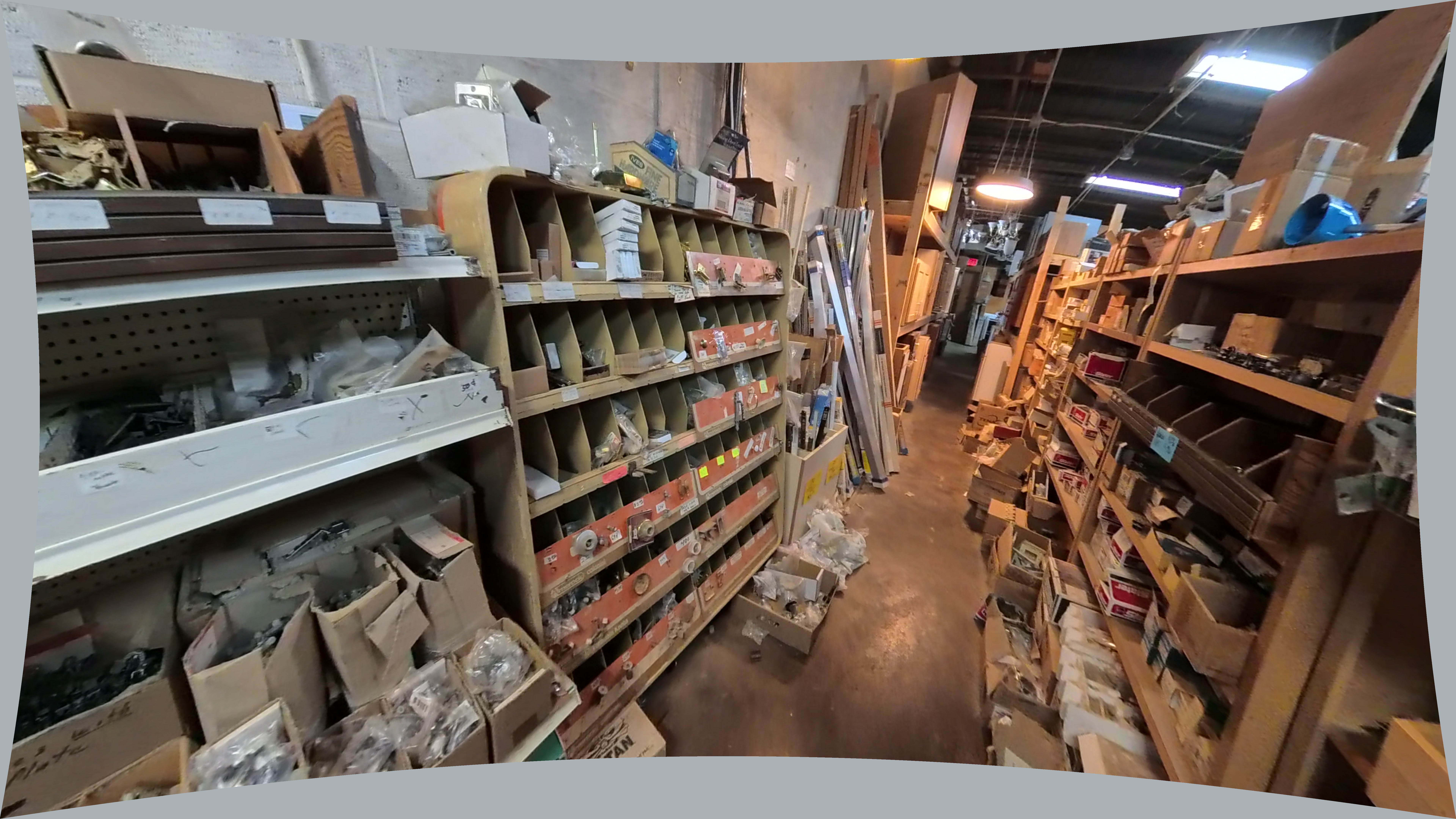 Bulk Hardware In Boxes And Bags On Metal Shelving