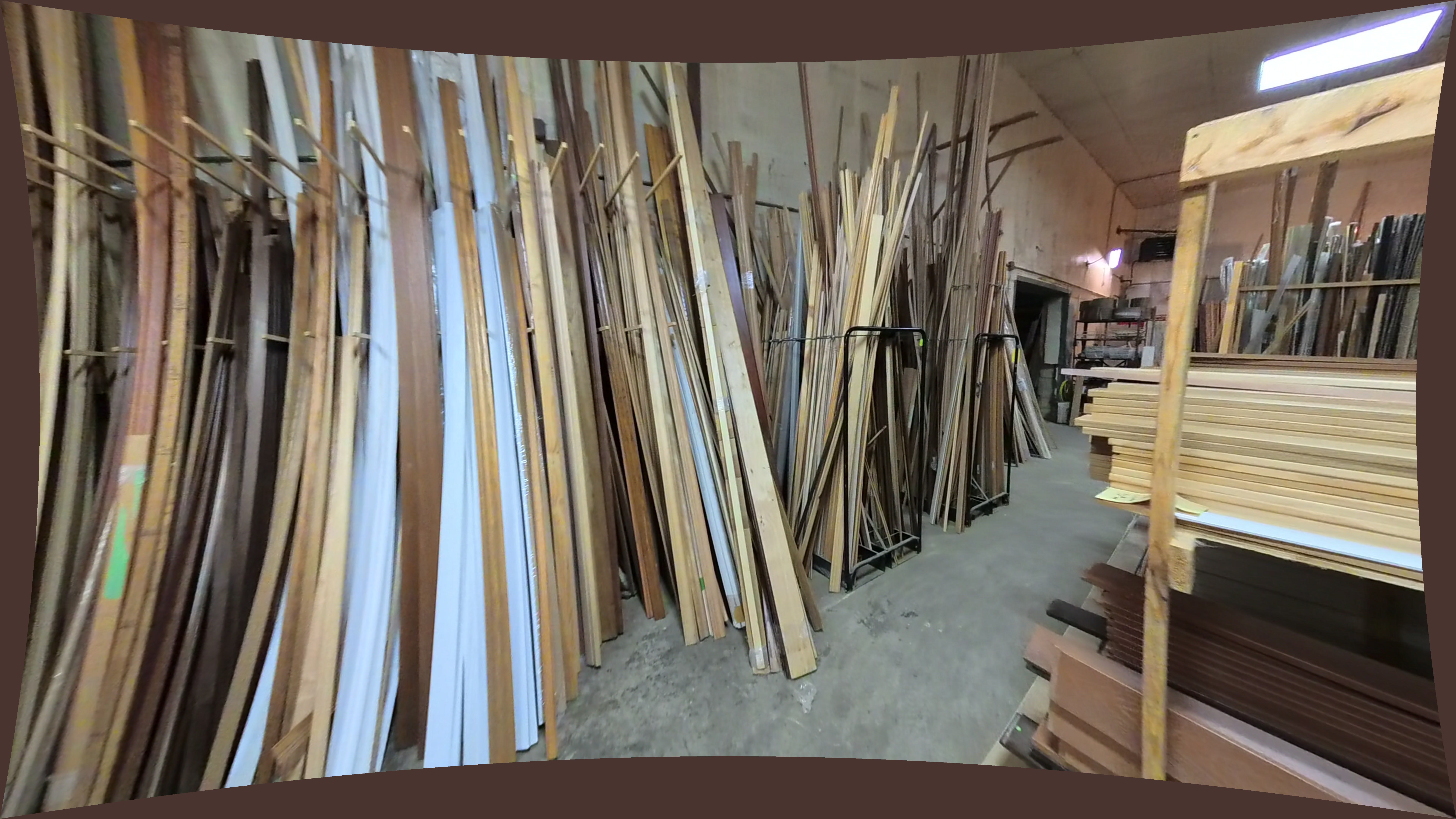 Frontline Bldg. Products Inc. Stacked Light Wood Lumber On Shelving Unit
